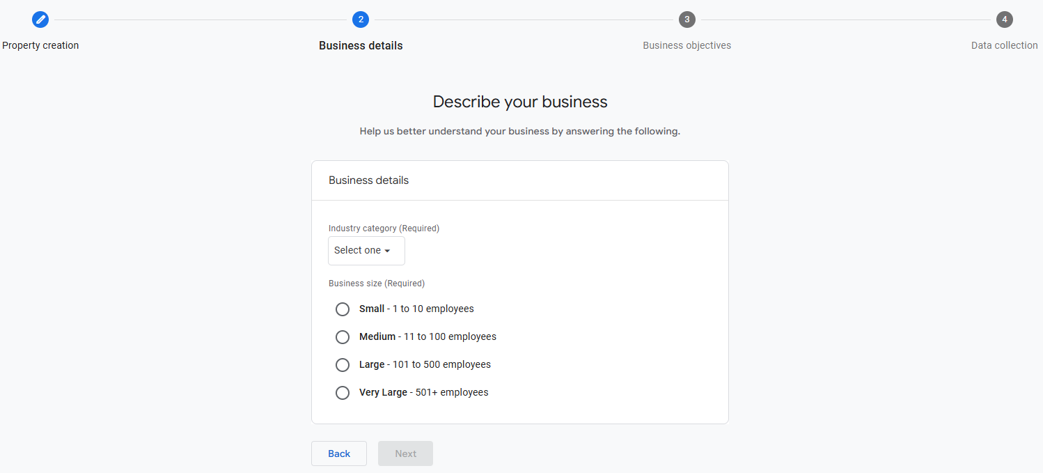 GA4 business information screen with industry category and business size options